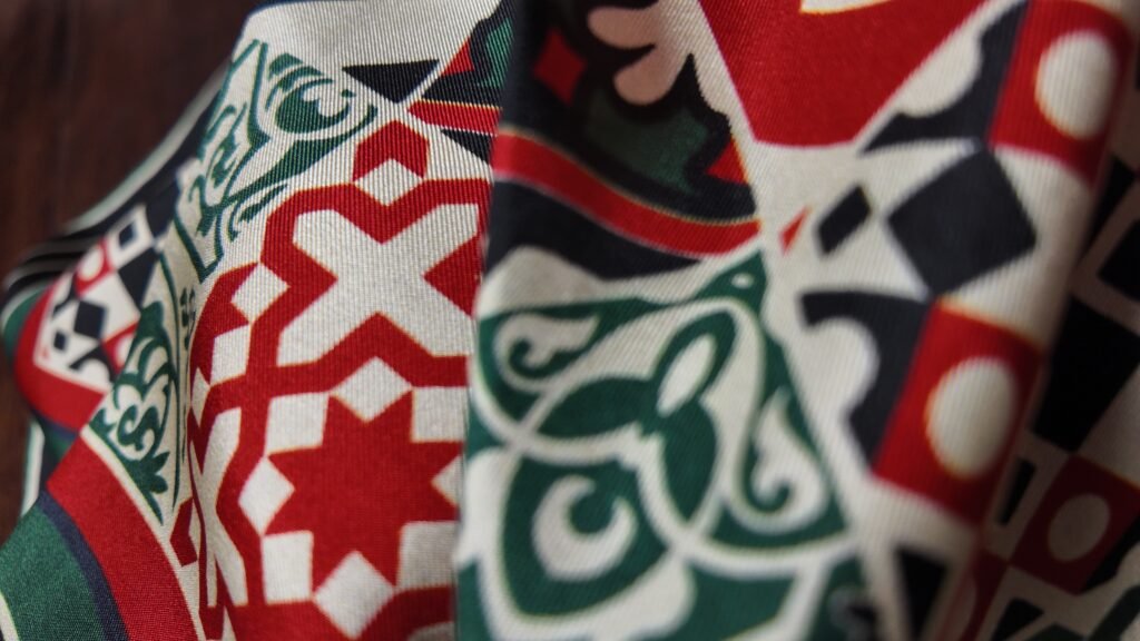 Close-up detail of a printed silk twill scarf